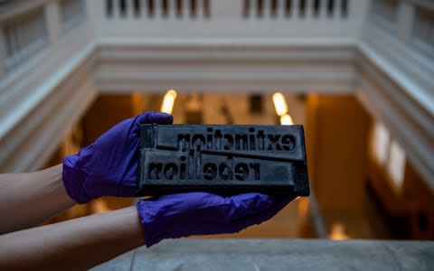 A 3D-printed Extinction Rebellion logotype block - Credit: Getty Images Europe/Chris J Ratcliffe