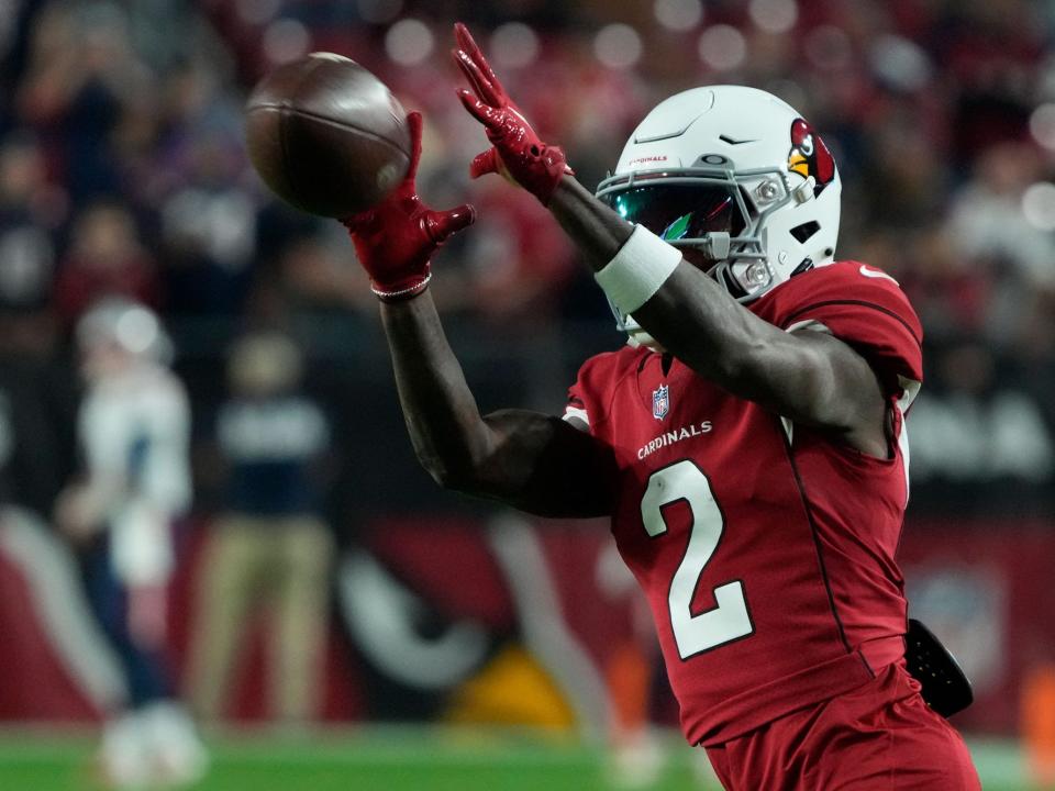 Marquise Brown warms up before a game against the New England Patriots.