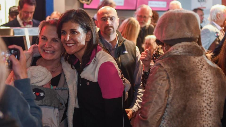 Former S.C. Gov. and United Nations Ambassador Nikki Haley takes a photo with a supporter after speaking at a public meet and greet on Thursday, Feb. 1, 2024, at Forrest Fire BBQ on Hilton Head Island.