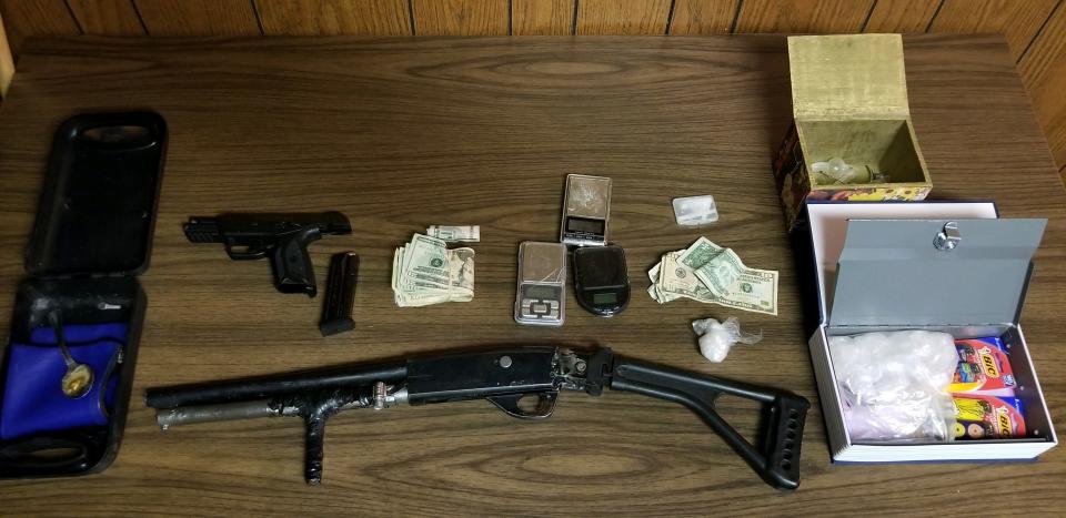 Firearms, narcotics, cash and drug paraphernalia were confiscated from a Glen Court residence Feb. 5, 2021.