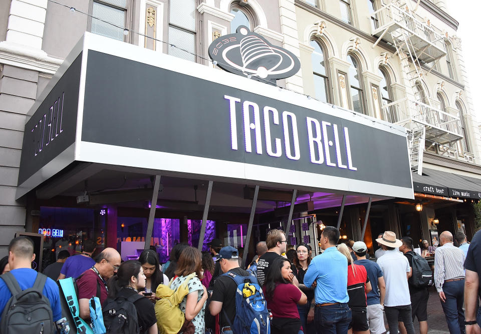 People line up in front of a Taco Bell event celebrating <em>Demolition Man</em>’s 25th anniversary, in San Diego during Comic-Con 2018. (Photo: Araya Diaz/Getty Images for Taco Bell)