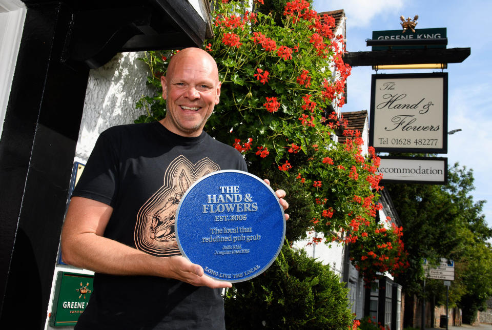 EDITORIAL USE ONLY Publican and chef, Tom Kerridge receives a personalised blue plaque from Jodie Kidd, commemorating her favourite pub memory, which took place at The Hand and Flowers in Marlow - Kerridge's first pub venture, as part of the Long Live The Local campaign.