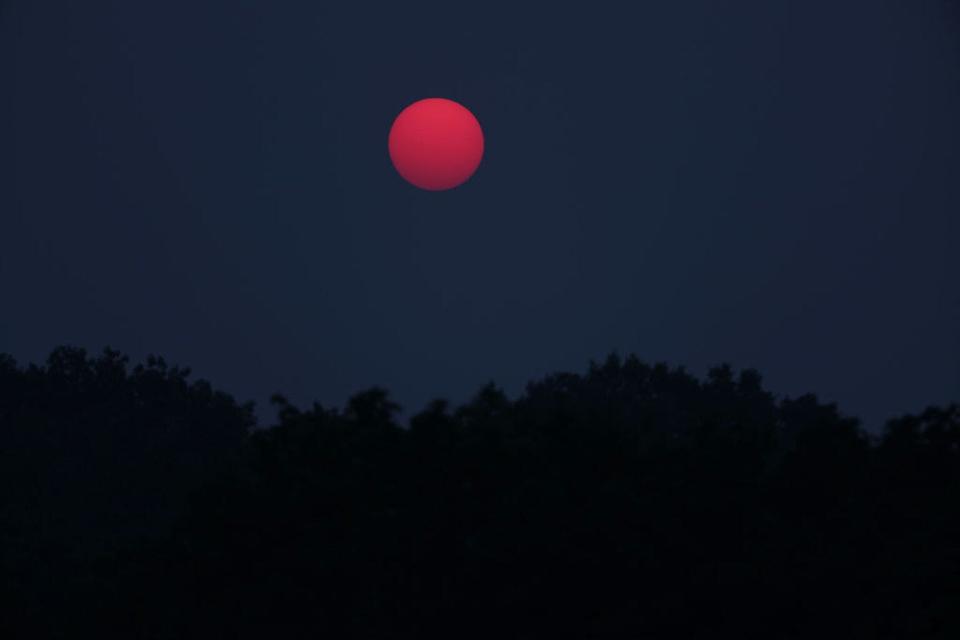 Air pollution alerts have been issued across the United States this summer due to smoke from wildfires that have been burning in Canada. Here, the sun rises above Elmont, New York, on June 8, 2023.