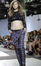 The Phillip Lim Spring 2013 collection is modeled during Fashion Week on Monday, Sept. 10, 2012, in New York. (AP Photo/Louis Lanzano)