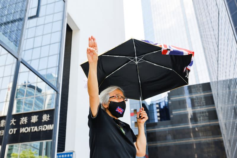 Alexandra Wong greets people (not in picture) outside the court who are supporting activists charged for participating in the assembly on June 4 to commemorate the 1989 crackdown on protesters in and around Beijing's Tiananmen Square