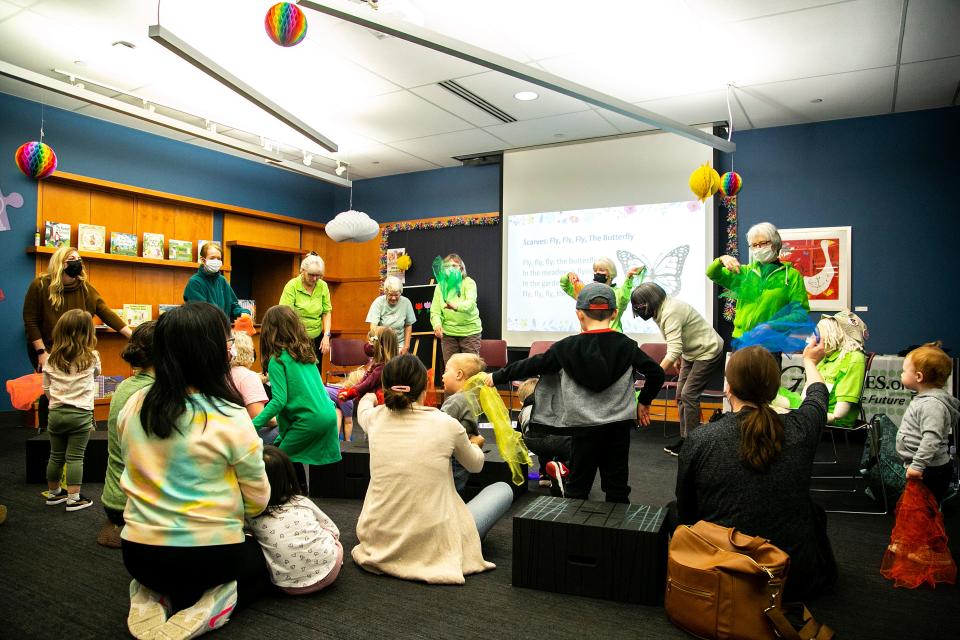 Members of the 100 Grannies perform a song during an Earth Day Storytime event, Thursday, April 21, 2022, at the Iowa City Public Library in Iowa City, Iowa.