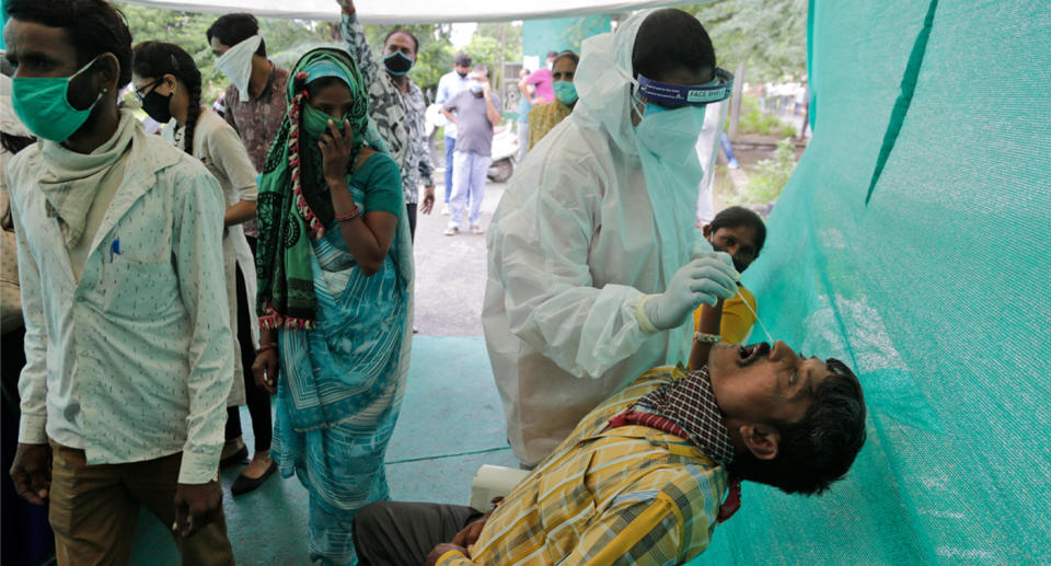 Inside a screening test tent for people coming from outside the city. Source: AP