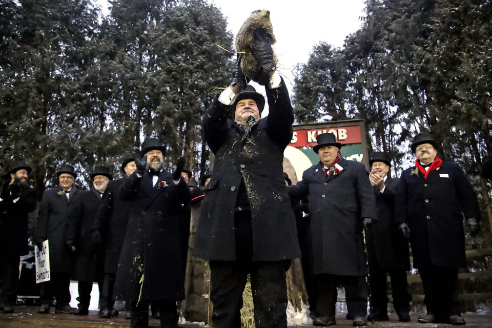 Groundhog Club co-handler John Griffiths, center, holds Punxsutawney Phil, the weather prognosticating groundhog, during the 133rd celebration of Groundhog Day on Gobbler’s Knob in Punxsutawney, Pa. Feb. 2, 2019. (Photo: Gene J. Puskar/AP)