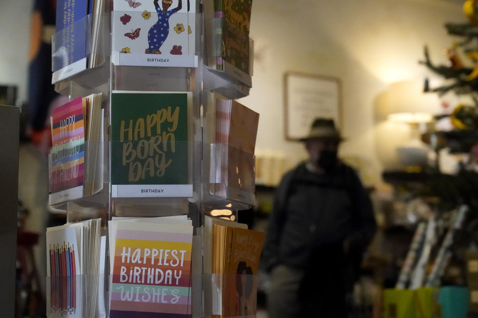 Birthday and greeting cards are displayed as customers shop at a Nathan & Co. store in Oakland, Calif., Monday, Dec. 12, 2022. Small retailers say this year looks much different than the last "normal" pre-pandemic holiday shopping season of 2019. They're facing decades-high inflation forcing them to raise prices and making shoppers rein in the freewheeling spending seen in 2021 when they were flush with pandemic aid and eager to spend. (AP Photo/Jeff Chiu)