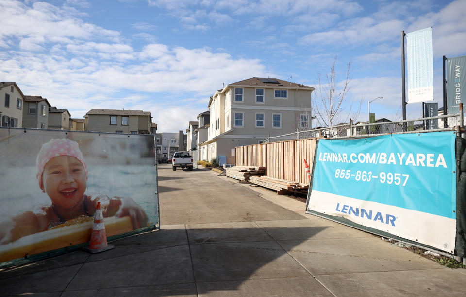 NEWARK, CALIFORNIA - DECEMBER 15: Signs are posted in front of homes at the Lennar Bridgeway home development on December 15, 2021 in Newark, California. Homebuilder Lennar will report fourth quarter earnings today after the closing bell. (Photo by Justin Sullivan/Getty Images)