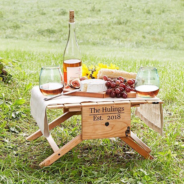 The outdoorsy couple can pack up their wine with this picnic carrier that turns into a table. <a href="https://fave.co/36u4ENZ" target="_blank" rel="noopener noreferrer">Get it at Uncommon Goods</a>.