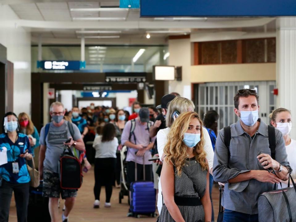 Visitors at the Daniel K. Inouye International Airport in Honolulu, Hawaii, enter the state after the new pre-travel testing program launched.