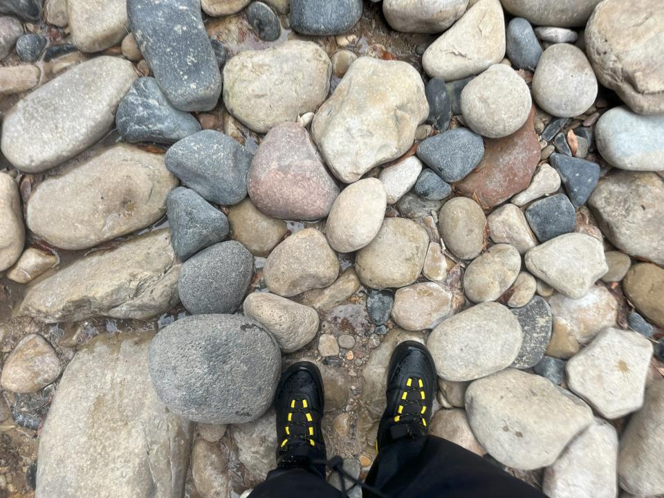Boots on rocks of different sizes
