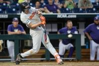 Jun 18, 2018; Omaha, NE, USA; Oregon State Beavers third baseman Michael Gretler (10) drives in a run with a single in the eighth inning against the Washington Huskies in the College World Series at TD Ameritrade Park. Mandatory Credit: Steven Branscombe-USA TODAY Sports