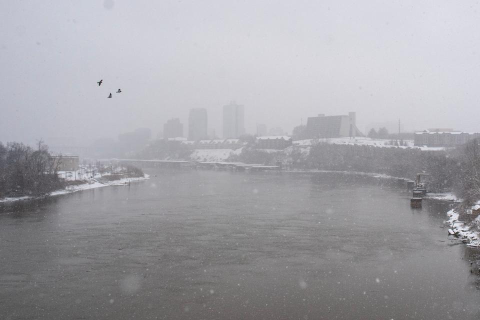 A view of the Tennessee River from the South Knoxville Bridge during a snow storm in Knoxville on Monday, January 15, 2024.