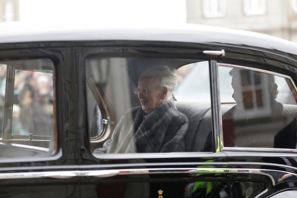 Queen Margrethe II of Denmark (L) rides back to the Amalienborg Palace after signing a declaration of abdication i