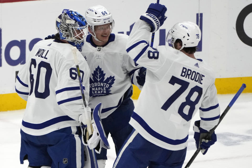 Toronto Maple Leafs goaltender Joseph Woll (60) celebrates with center David Kampf (64) and defenseman TJ Brodie (78) after the team's over the Florida Panthers in Game 4 of an NHL hockey Stanley Cup second-round playoff series Wednesday, May 10, 2023, in Sunrise, Fla. (AP Photo/Lynne Sladky)