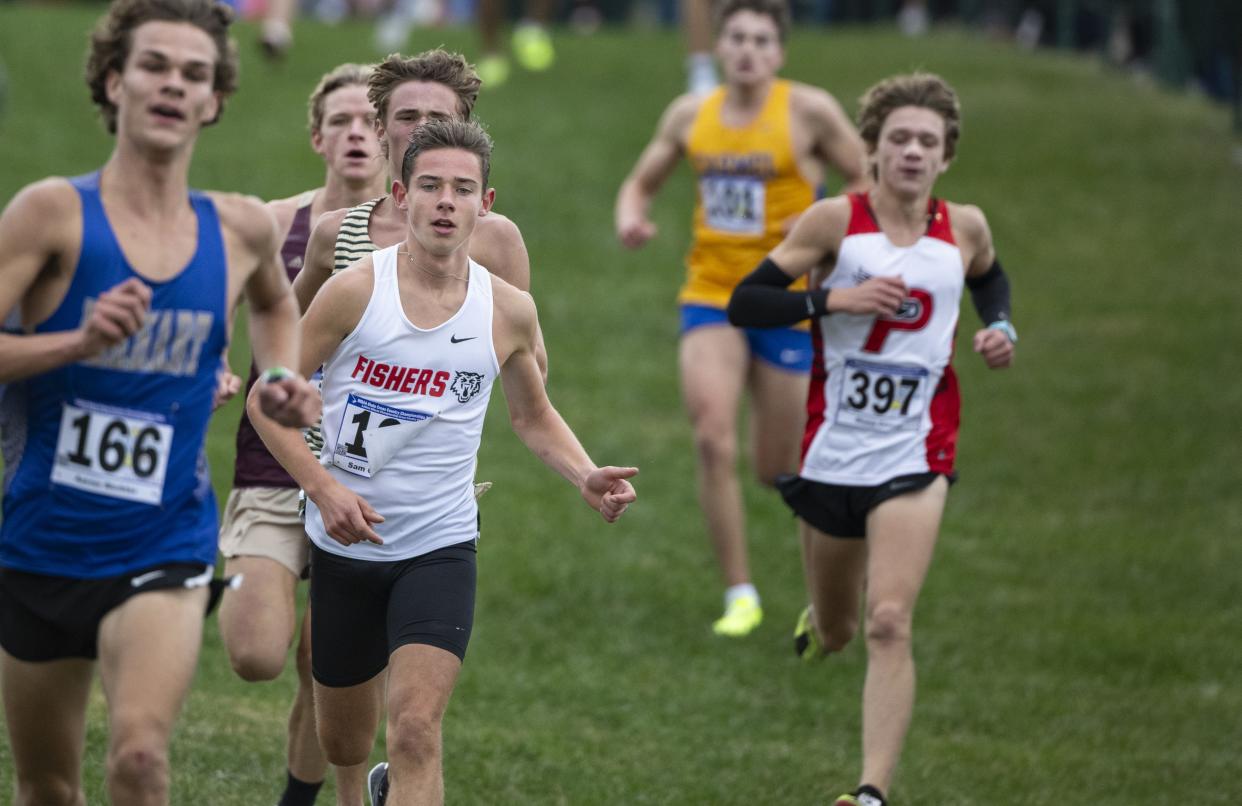 Fishers High School junior Sam Quagliaroli runs in a pack during the 78th annual IHSAA Boys Cross Country State Championship, Saturday, Oct. 28, 2023, at LaVern Gibson Championship Cross County Course.