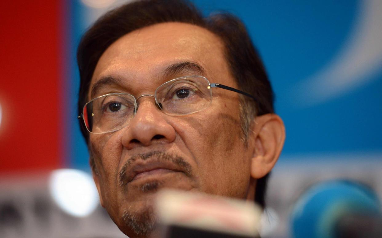 Opposition leader Anwar Ibrahim is set to be pardoned - AFP