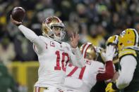 San Francisco 49ers' Jimmy Garoppolo throws during the first half of an NFC divisional playoff NFL football game against the Green Bay Packers Saturday, Jan. 22, 2022, in Green Bay, Wis. (AP Photo/Aaron Gash)