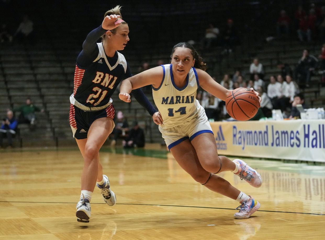 Marian's Nevaeh Foster, right, shown December 29, 2022, is poised to lead her team on a long postseason run.