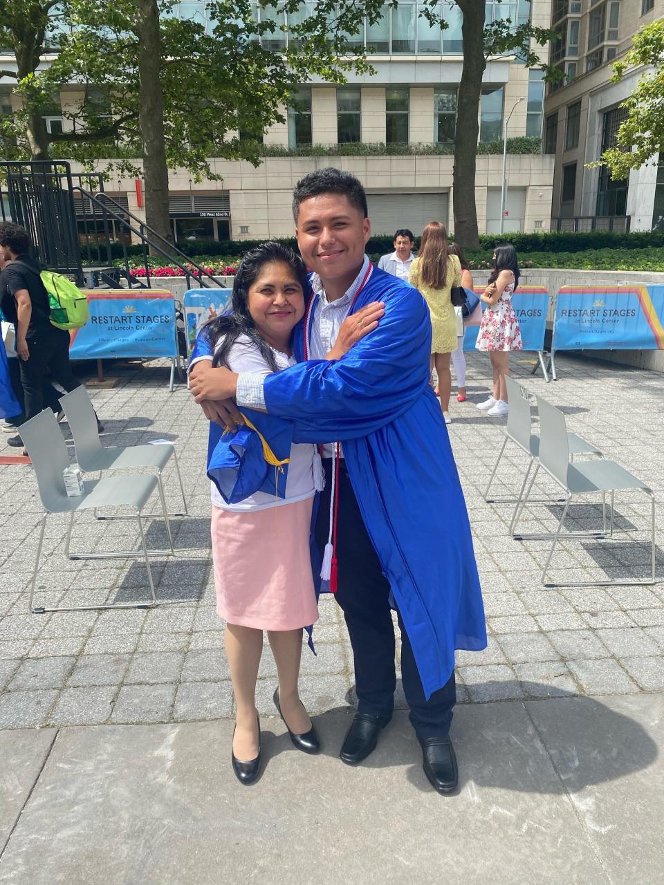 Kevin Villanueva with his mom at his high school graduation.