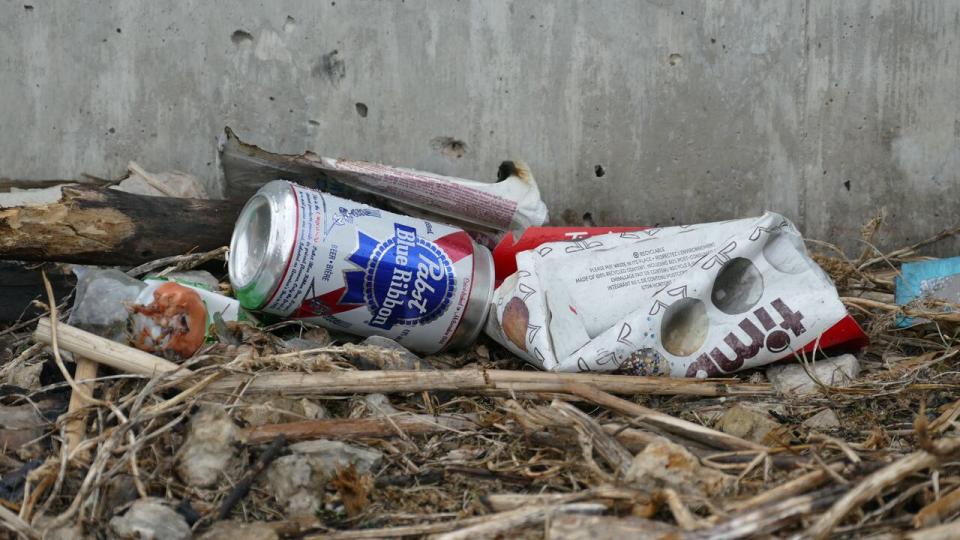 An empty Michael Komenda memorial skate park during the COVID-19 pandemic. See littered trash. 