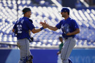 Israel's Benjamin Wanger, right, and Ryan Lavarnway celebrate after Israel won a baseball game against Mexico at Yokohama Baseball Stadium during the 2020 Summer Olympics, Sunday, Aug. 1, 2021, in Yokohama, Japan. (AP Photo/Matt Slocum)