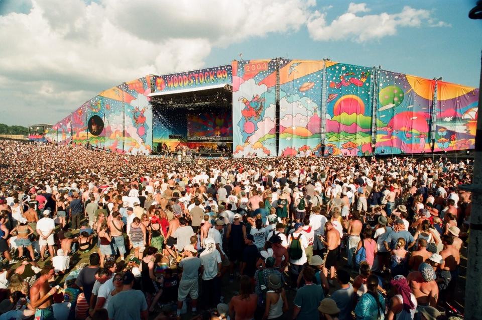 A throng of people gather at one of the festival's stages. Estimates of attendees range from 225,000-400,000.