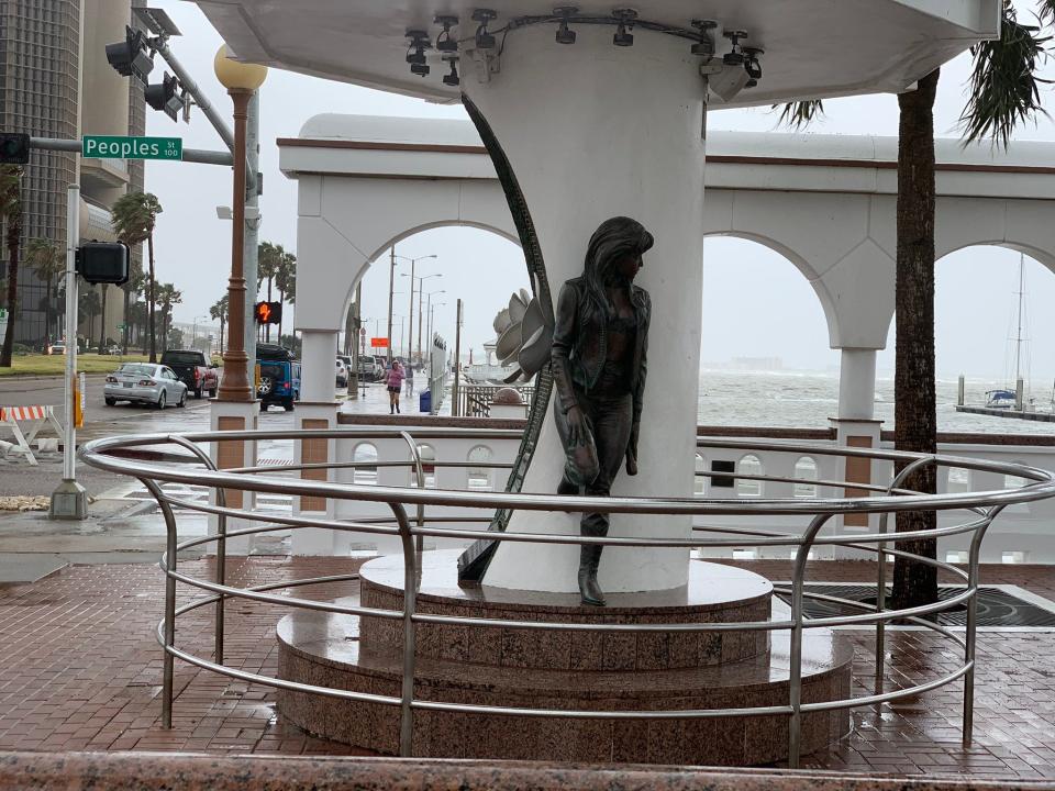 The Selena Memorial Statue is still standing strong in downtown Corpus Christi despite the sea wall and T-head surrounding it being flooded.