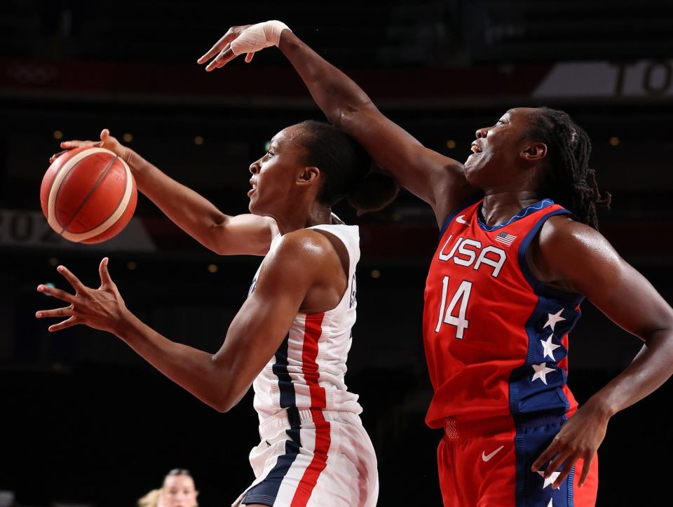 Tina Charles defends against French star Sandrine Gruda.