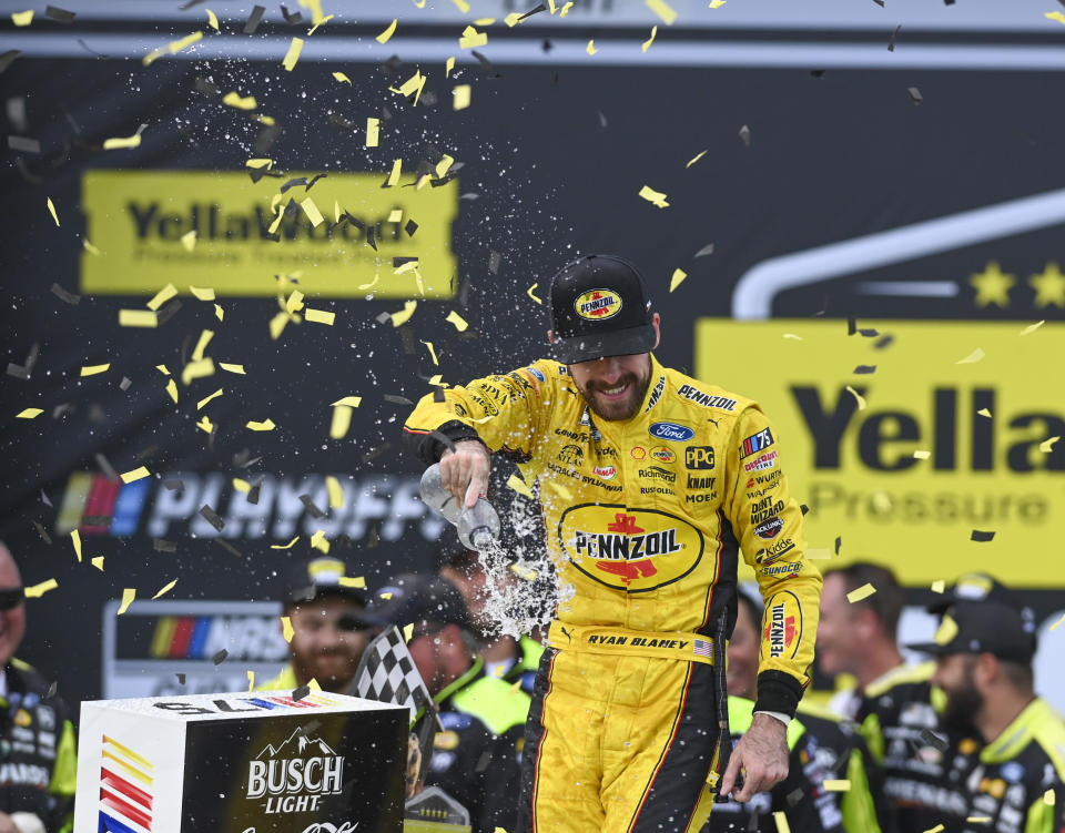 Ryan Blaney, front center celebrates after winning a NASCAR Cup Series auto race at Talladega Superspeedway, Sunday, Oct. 1, 2023, in Talladega, Ala. (AP Photo/Julie Bennett)