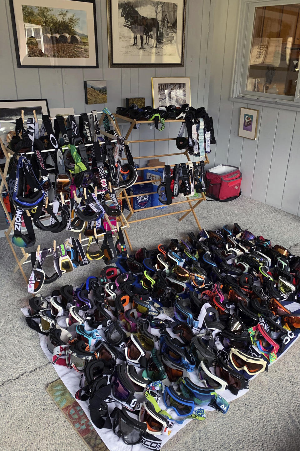 In this photo provided by Dan Hogan, ski goggles collected for GogglesForDocs are shown at the Windham Mountain ski lodge in Windham, N.Y. Olympic athletes, recreational skiers/snowboarders and businesses are rounding up as many new or used snow goggles with one clear vision: To aid those in the medical community who are in need of eye protection as they treat patients with COVID-19. It's part of a program called “Goggles for Docs," a grassroots effort that began in late March. (Dan Hogan/Windham Mountain via AP)