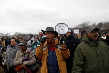 Activists march during the National Action Network's "We Shall Not Be Moved" march in Washington, DC, U.S., January 14, 2017. REUTERS/Aaron P. Bernstein