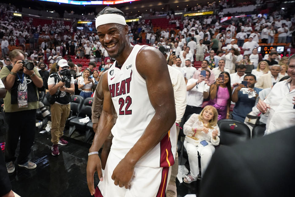 Miami Heat forward Jimmy Butler (22) reacts after the Heat beat the New York Knicks 96-92 during the second half of Game 6 of an NBA basketball second-round playoff series, Friday, May 12, 2023, in Miami. (AP Photo/Wilfredo Lee)