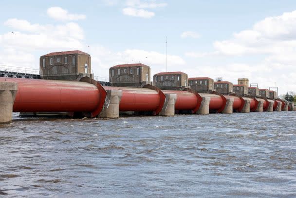 PHOTO: The roller dams for Lock and Dam 15 are raised as the Mississippi River levels continue to rise, April 21, 2023, Davenport, Iowa. (Nikos Frazier/Quad City Times via AP)