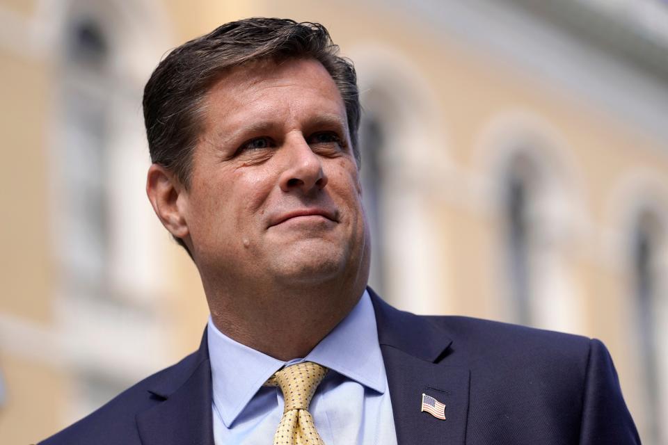 Republican gubernatorial candidate Geoff Diehl faces reporters outside the State House in Boston on Monday, March 21, 2022.