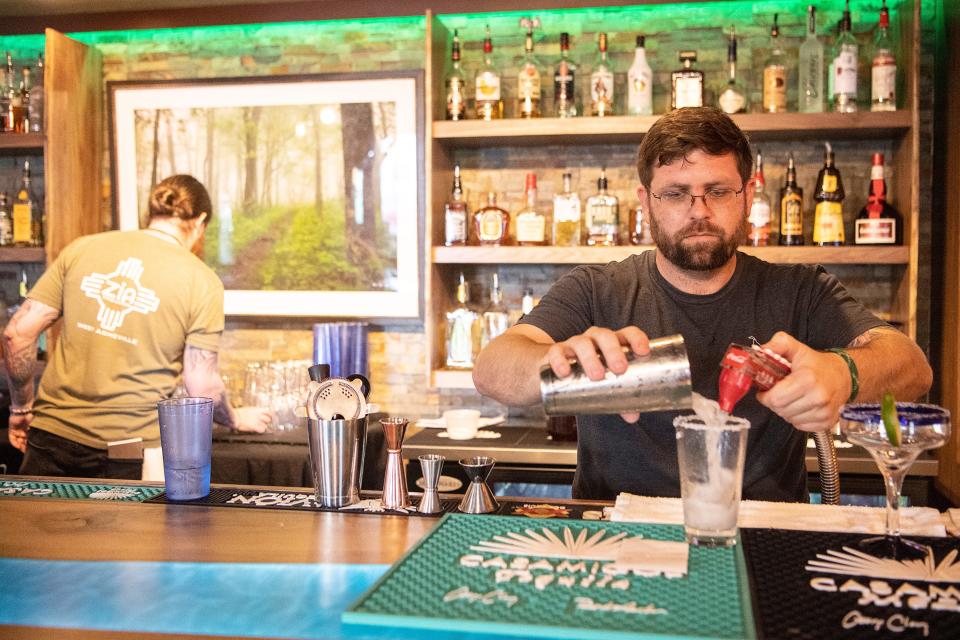 Steve Roehner makes a drink at Zia Taqueria in West Asheville February 24, 2022.