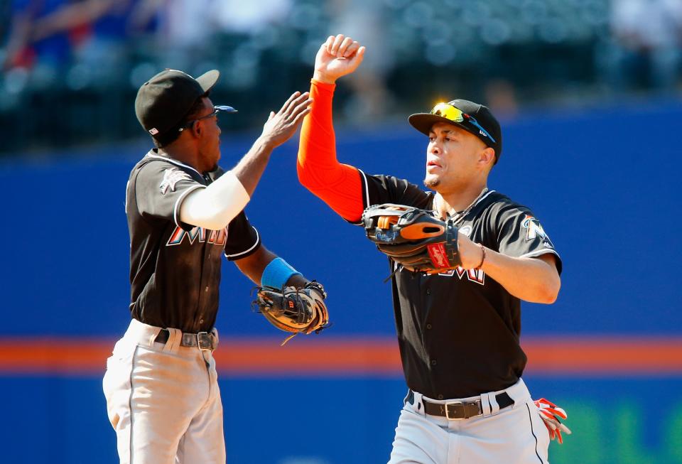 The Marlins have already traded Dee Gordon (left). Will Giancarlo Stanton be next? (Getty)