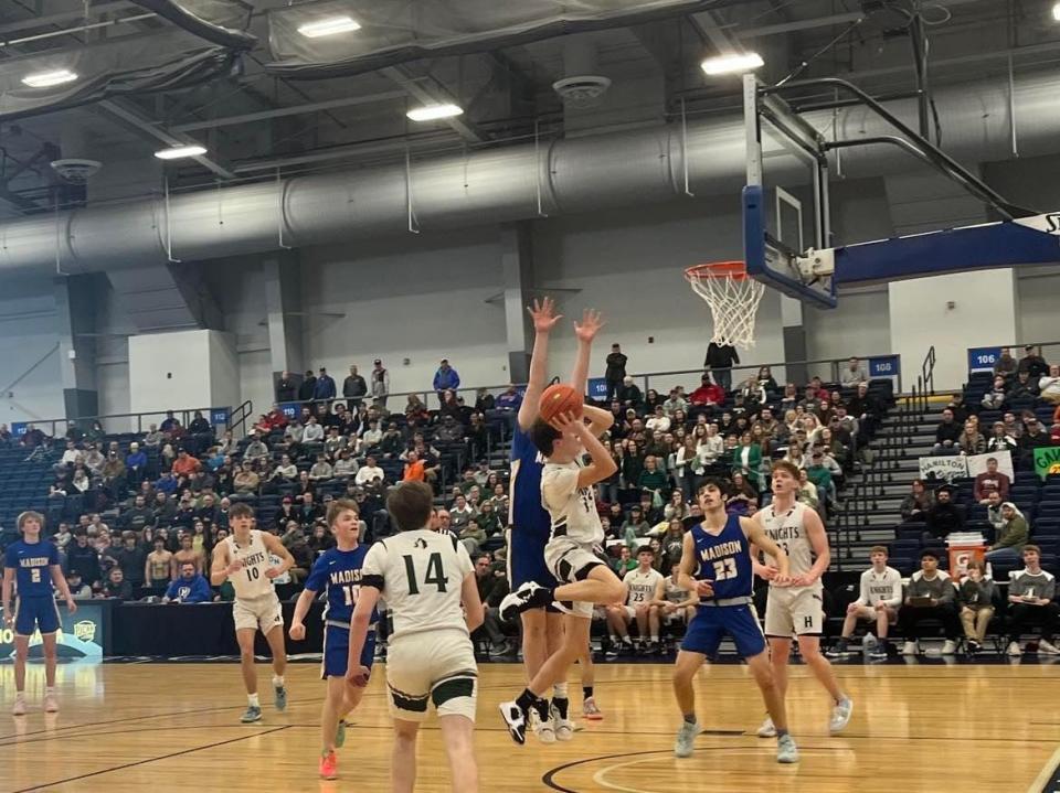 Hamilton's Hudson Idzi drives in for a layup in the Emerald Knights 52-42 win over Madison in the Section III Class D semifinal at SRC Arena in Syracuse on February 25, 2022.