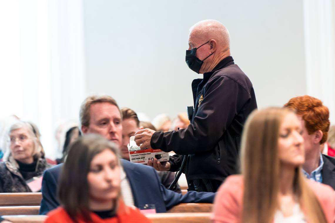 A Colleton County Sheriff’s Deputy hands out masks during day 16 of the double murder trial of Alex Murdaugh at the Colleton County Courthouse on Monday, Feb. 13, 2023. Jeff Blake/The State/Pool