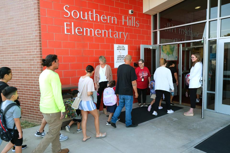 Principal Julianne Hennessey, right, greets students and family. Southern Hills Elementary School. First day of Oklahoma City Public Schools. Thursday, Aug. 10, 2023