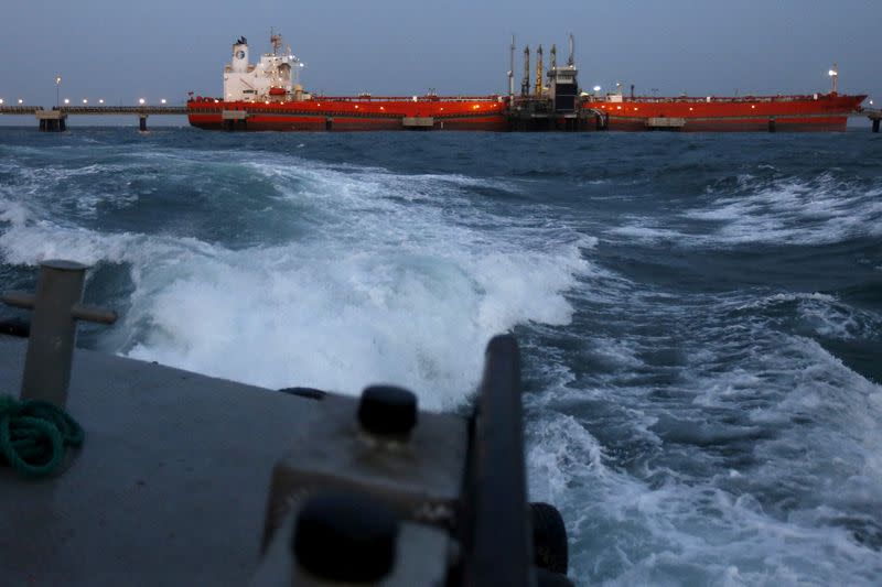 FILE PHOTO: An oil tanker is docked while oil is pumped into it at the ships terminal of PDVSA's Jose Antonio Anzoategui industrial complex in the state of Anzoategui