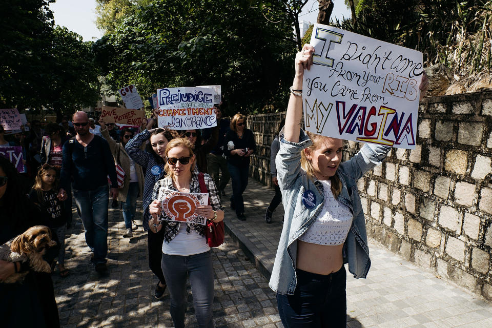 Protesters hold placards as they take part at the Women's March rally on January 21, 2017 in Macau, Macau. The Women's March originated in Washington DC but soon spread to be a global march calling on all concerned citizens to stand up for equality, diversity and inclusion and for women's rights to be recognized around the world as human rights.&nbsp;