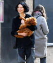 <p>Newlywed Meadow Rain Walker totes her pup through New York City's SoHo neighborhood on Nov. 17.</p>