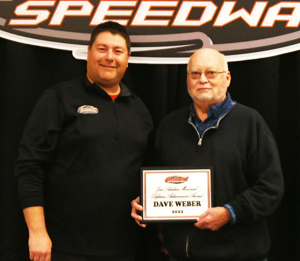 The Jim Schahrer Memorial Lifetime Achievement Award for 2022 was presented to longtime Fairbury official Dave Weber of Pontiac, right. Making the presentation is Fairbury Speedway owner and president Matt Curl.