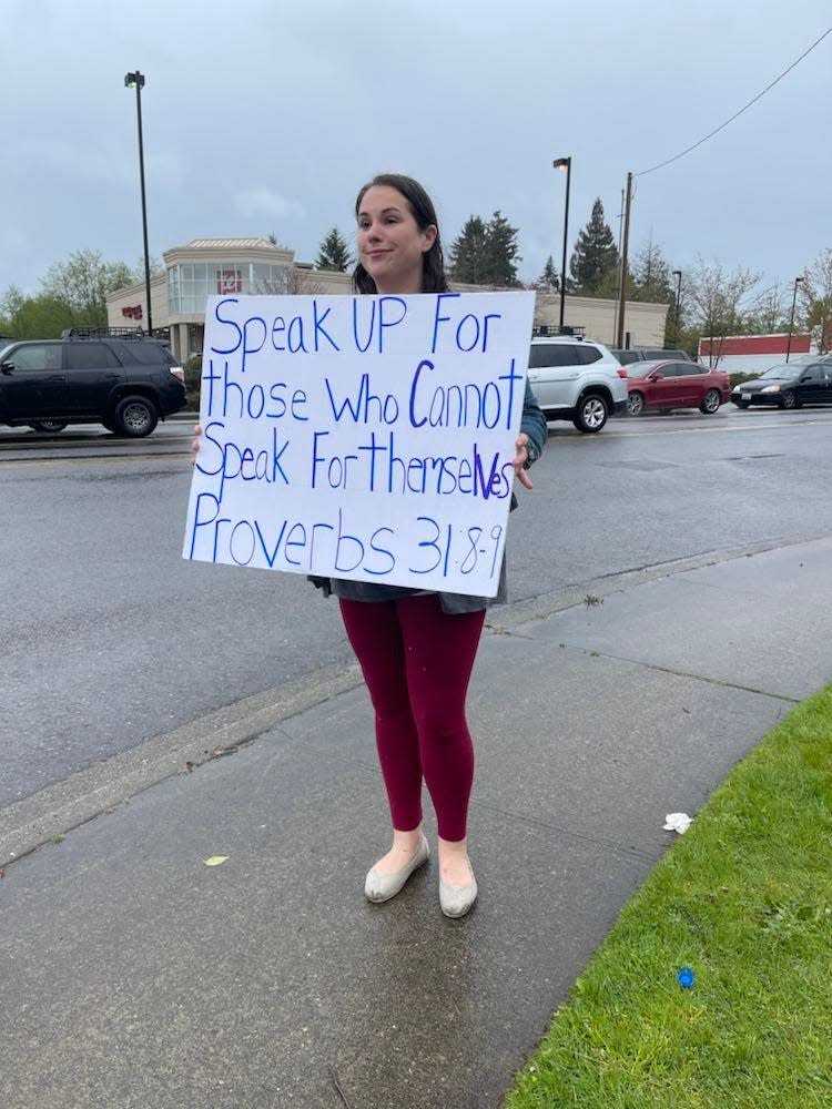 Kareena English of Port Orchard holds a sign at a rally in Port Orchard on Thursday she organized with her children to express support of the U.S. Supreme Court overturning Roe v. Wade, which has guaranteed access to abortion in the U.S. since the early 1970s.