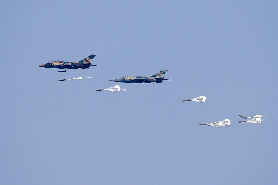 FILE - Myanmar Air Force Jet fighters drop bombs during military exercises Friday, Feb. 2, 2018, in Ayeyarwaddy delta region, Myanmar. A report by a U.N. expert on human rights charges that Thai banks have become the main supplier of cross-border financial services for Myanmar’s military government, enabling its purchases of goods and equipment used to carry out its increasingly bloody war against pro-democracy resistance forces and armed ethnic minority groups. (Lynn Bo Bo/Pool via AP, File)