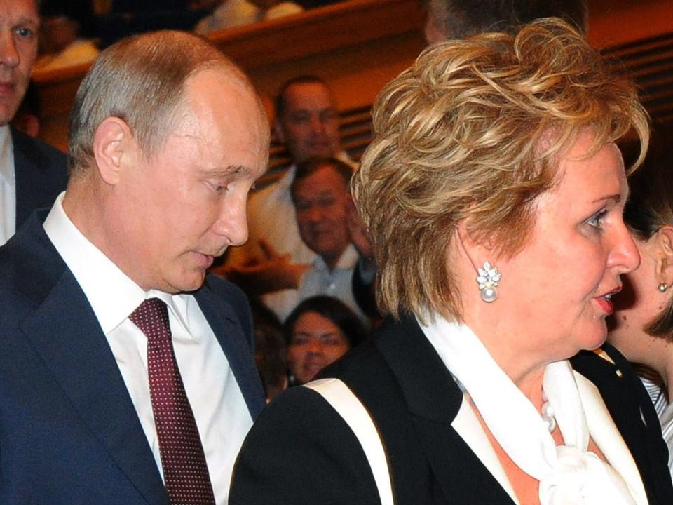 Head-and-shoulder shot of President Vladimir Putin and his wife Lyudmila walking through the State Kremlin Palace in Moscow, on June 6, 2013, the day they announced their divorce.