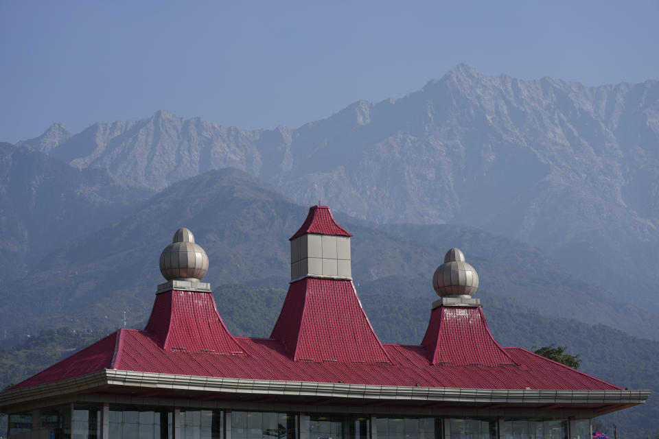 A view of the mountains from the Himachal Pradesh Cricket Association stadium during the ICC Cricket World Cup match between Afghanistan and Bangladesh in Dharamsala, India, Saturday, Oct.7, 2023. (AP Photo/Ashwini Bhatia)